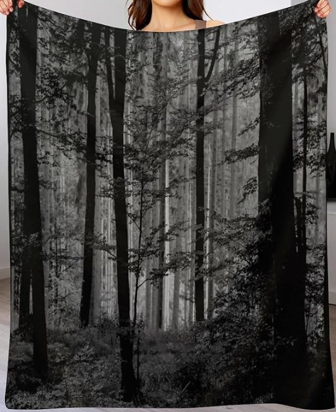 Black-and-gray forest blanket with a moody woodland design